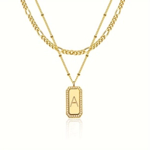 Detail view of double-layer gold necklace with rectangular letter A pendant and zircon stones
