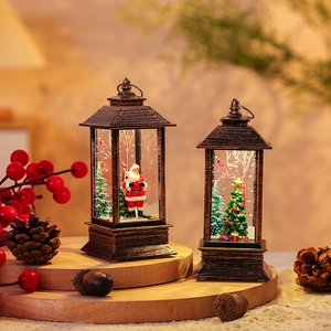 Close-up of vintage bronze Christmas lantern with Santa scene and festive LED lighting