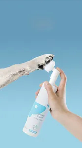 Handheld pet paw cleaning foam with silicone brush head and gentle coconut oil formula