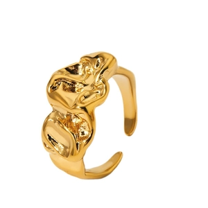 Irregular wrinkled texture open ring in golden metal finish with fluid aesthetic design