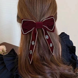 Detailed back view of red velvet bow hair clip with gold beads and vintage rhinestones