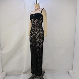 Detail of elegant black lace maxi dress with rose patterns and slim fit silhouette