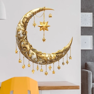 Golden crescent moon wall decor with carved patterns and star charms in modern living room