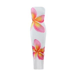 Detailed close-up of pink and yellow floral print on a white tube maxi dress