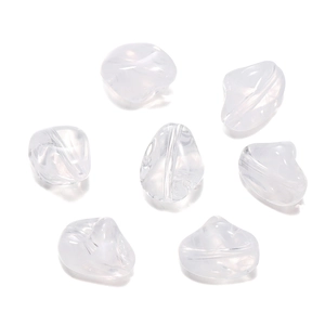 Close-up of irregular pebble-shaped acrylic beads with pre-drilled holes for DIY jewelry