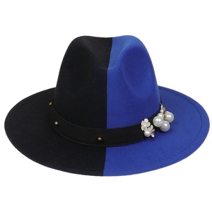 Detail view of two-tone wool felt fedora featuring pearls and floral decorations