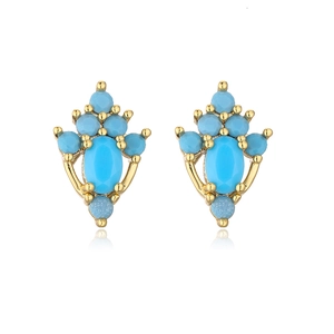 Detail of gold earrings featuring blue oval zircon stones and frosted accent beads