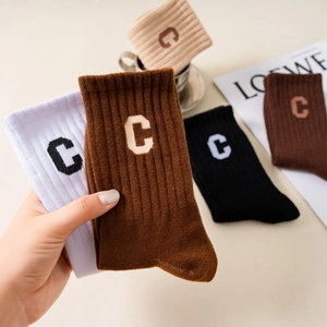 Vertical ribbed mid-calf sports socks with letter C embroidery in neutral colors