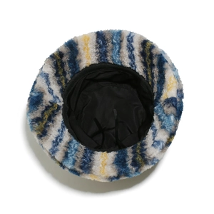 Close-up of fluffy striped bucket hat showing wave texture and adjustable inner drawstring