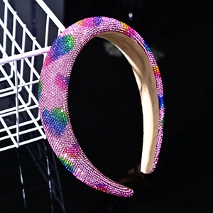 Detail of pink sponge headband with colorful rhinestone hearts and beige lining