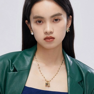 Golden necklace with heart chain and bear pendants with snowflake reindeer earrings