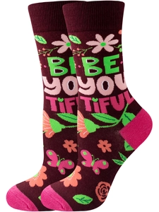 Detail of burgundy cotton knit socks with floral patterns and 'BE YOU TIFUL' text