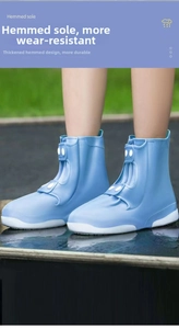 Blue waterproof silicone shoe cover with hemmed sole and button closure detail
