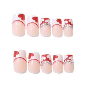 Short square press-on nails with red heart designs and rhinestones for Valentines Day