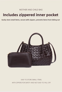 Detail of dark brown woven tote with gold hardware and matching zipper inner pouch