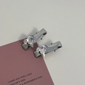 Close-up of pink heart rhinestone hair clips on card with gift message greeting