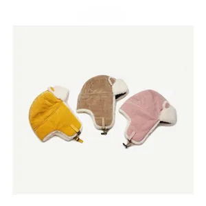 Three plush winter aviator hats with corduroy fabric and warm faux shearling lining