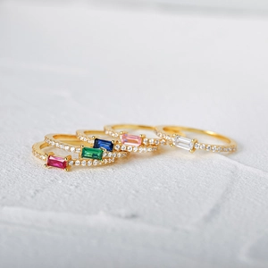 Detailed close-up of S925 silver rings with colorful rectangle zircon stones in gold finish