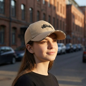 Classic beige baseball cap with SPORT brim print and 3D letter embroidery on a model