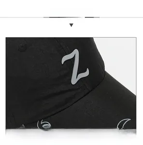 Close-up of black mesh cap with 3D letter Z logo and detailed fabric texture