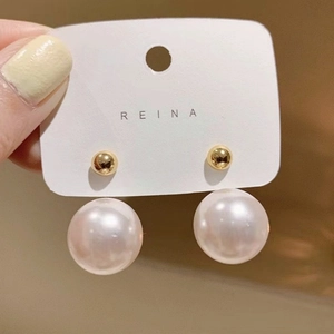 Elegant gold ball stud earrings with large white pearl drop on white display card