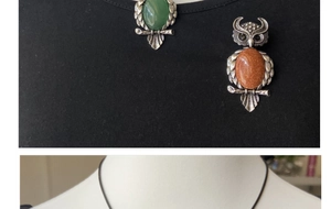 Detail view of owl pendant brooches featuring natural green and amber crystal gemstones