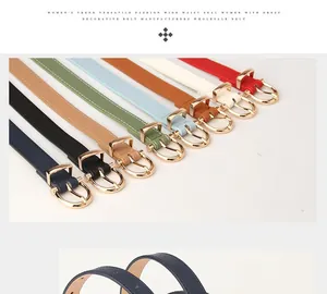 Close-up of slim PU leather belts in eight colors featuring gold round metal buckles