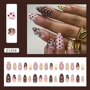 Polka dot press-on nails with 3D floral accents in yellow and pink, model Z1254