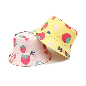 Cute kids strawberry print bucket hats in pink and yellow for outdoor sun protection