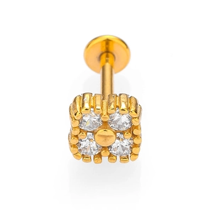 Macro detail of gold 316L stainless steel labret stud with four square cubic zirconia