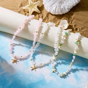 Bohemian natural stone choker necklaces with starfish pendants and pearl beads on sand