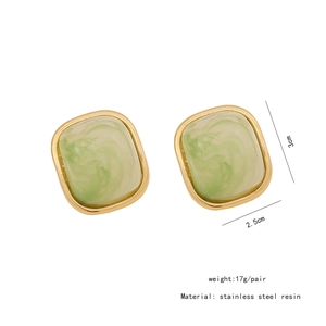 Detailed view of green resin earrings with gold stainless steel edges and size specs