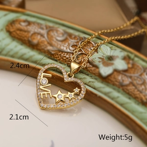 Detail of 18K gold heart pendant with LOVE engraving and star zircons, 2.4cm by 2.1cm