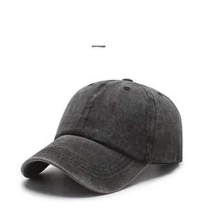 Detail of dark grey washed cotton baseball cap with vintage distressed texture