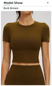Detail view of dark brown tight-fitting yoga t-shirt and high-waist leggings on model