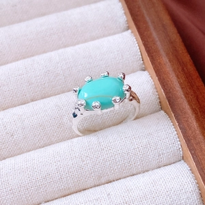 Macro shot of 18K gold plated vintage ring with turquoise stone and ornate detailing