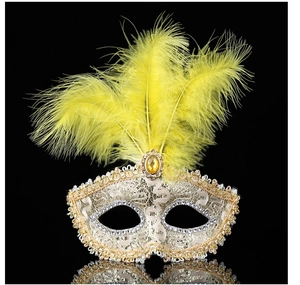 Detail of yellow feathers and lace masquerade mask with amber gemstone and sequins