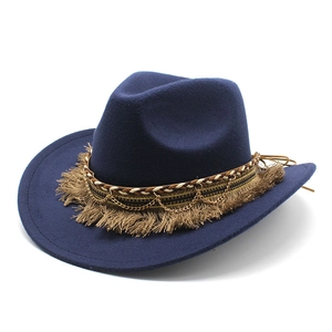 Detailed close-up of dark blue wool fedora hat with bohemian tassel and chain band
