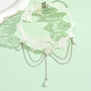 Detail of white floral lace choker with silver chains and teardrop pearl pendants