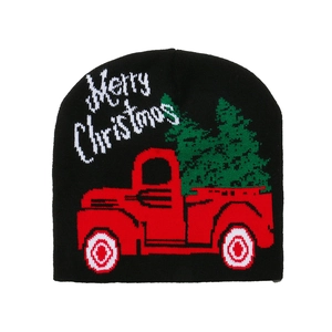 Detail of black knit beanie with red truck and Merry Christmas jacquard pattern