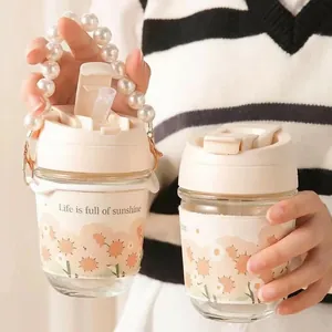 Dual-drink glass cup with sunflower sleeve and decorative pearl handle chain