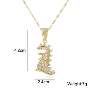 Detailed view of 18K gold dinosaur pendant with dimensions 4.2cm by 2.4cm and 7g weight