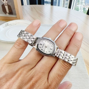 Elegant women's oval silver quartz watch with Arabic numerals on a white dial