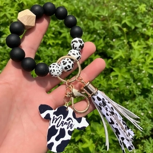 Cow print silicone bead wristlet keychain with wooden bead and Mama cow head charm