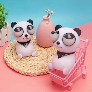 Funny panda stress relief toys with pop-out eyes in a pink mini shopping cart