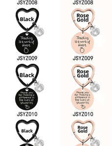 Detail of apple keychain with crystal and engraved message Teaching is a work of Heart