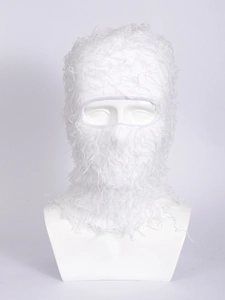 Detail shot of soft white plush balaclava mask texture and knitted fabric for winter warmth