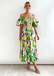 Detail of off-shoulder puff sleeves and vibrant floral print on summer maxi dress