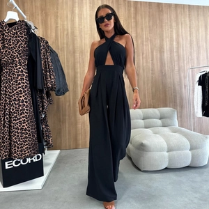 Elegant black halter neck jumpsuit with cross-collar and wide leg silhouette