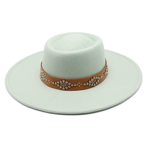 Detail of felt fedora hat brim featuring a brown leather band with silver metal rivets